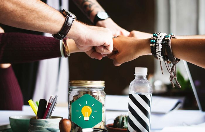 Circle of hands in a "fist bump"