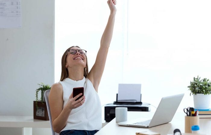 NAFS & Grimsby Creates | Woman raising arm in success