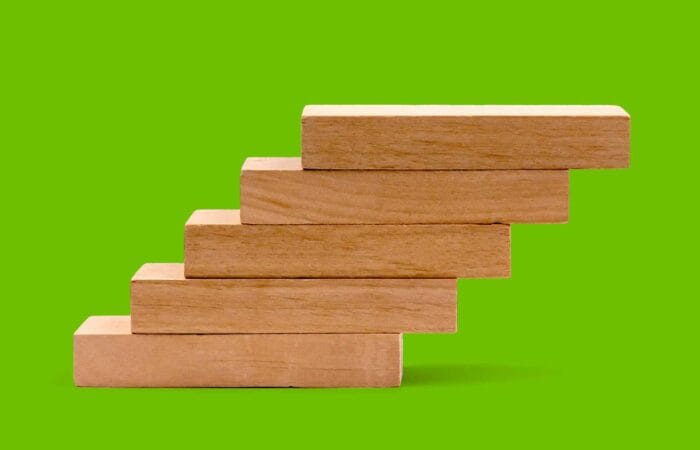 Decision Science Arts Fundraising — Stair blocks on a green background